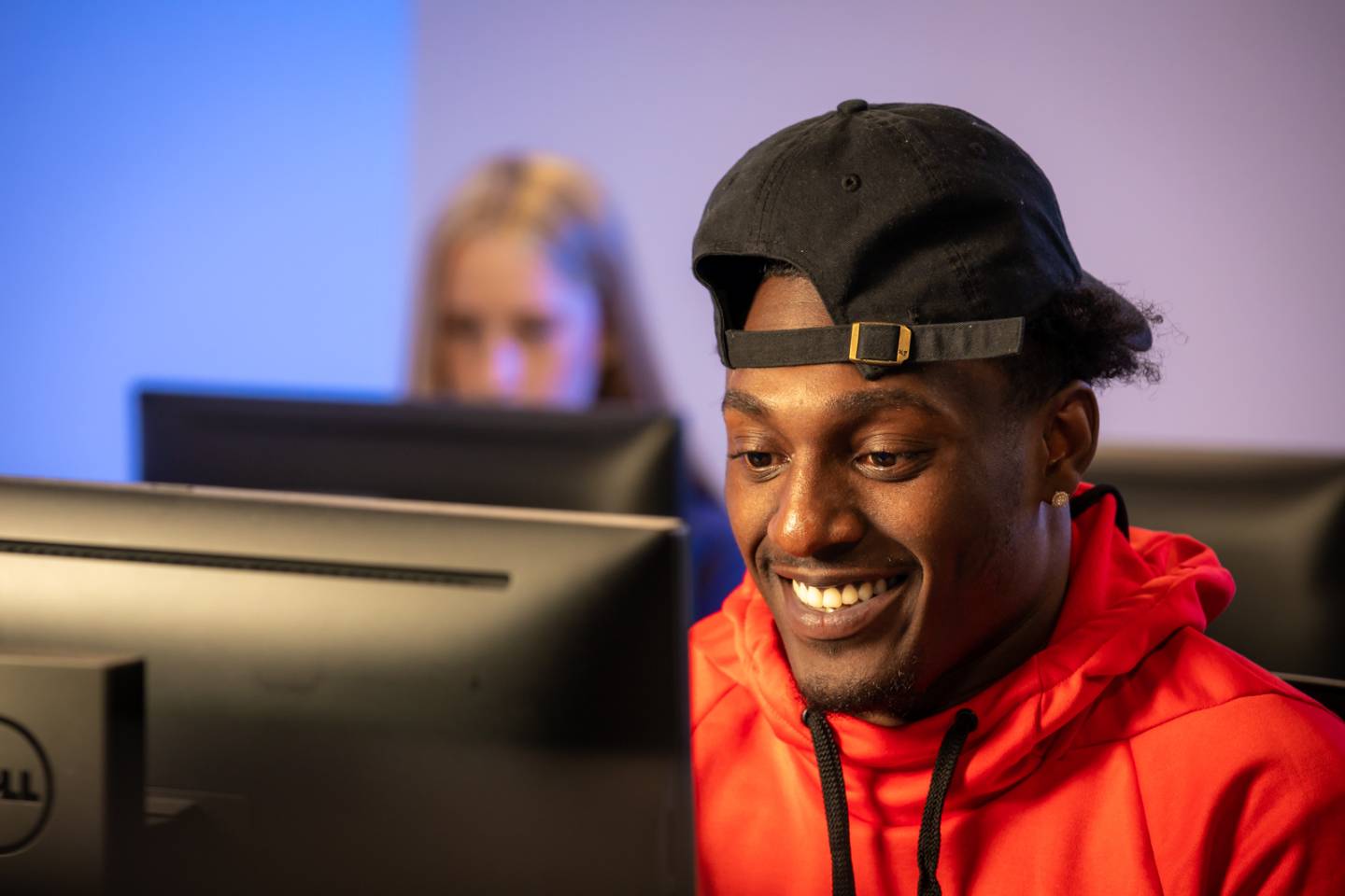 a boy looking at a computer