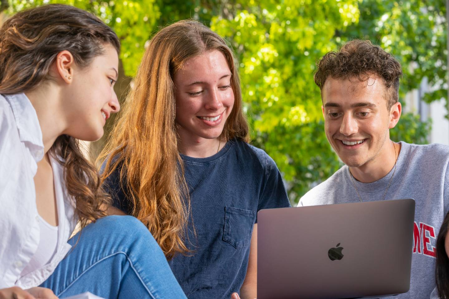 Three students collaborating on a project