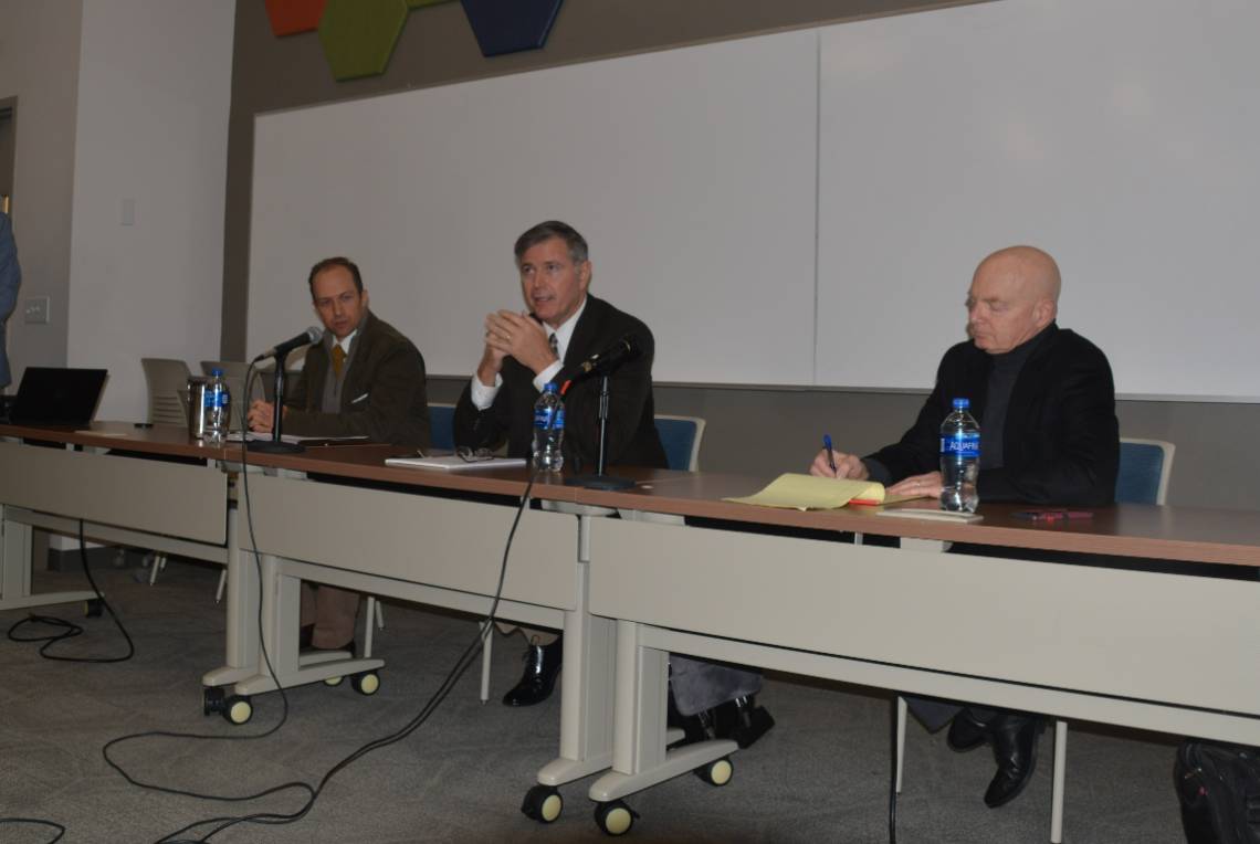 three Duquesne professors conducting faculty roundtable event for current students.