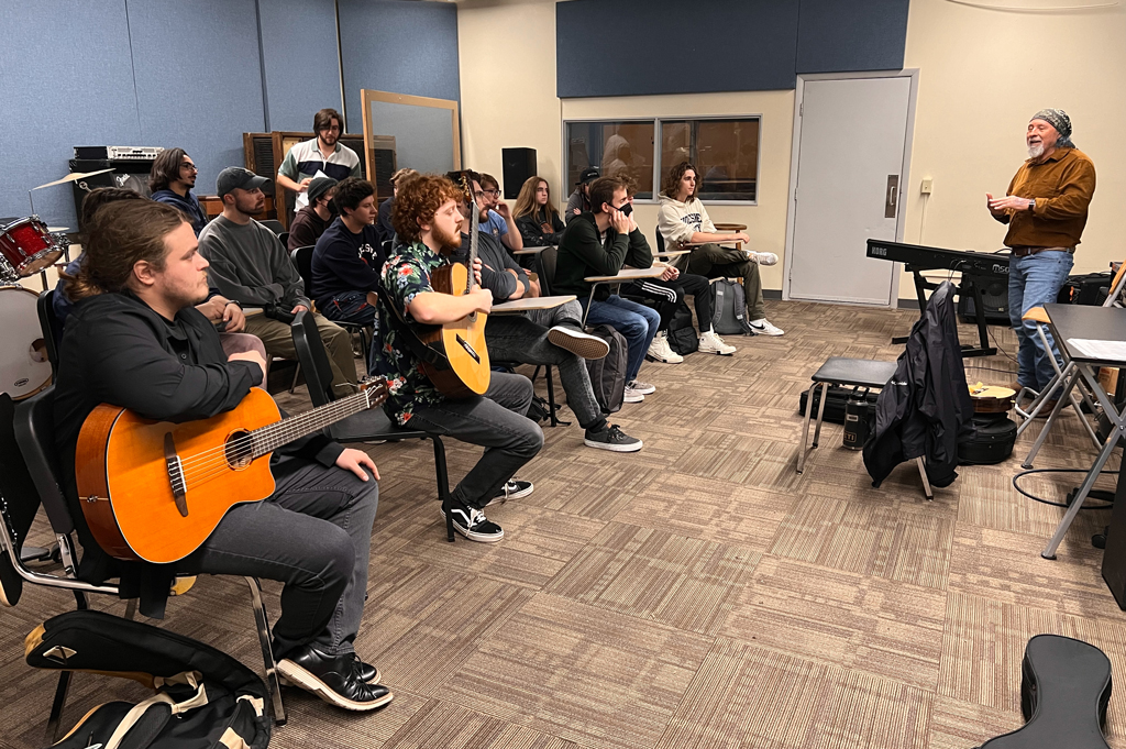 Miguel Espinoza works with students