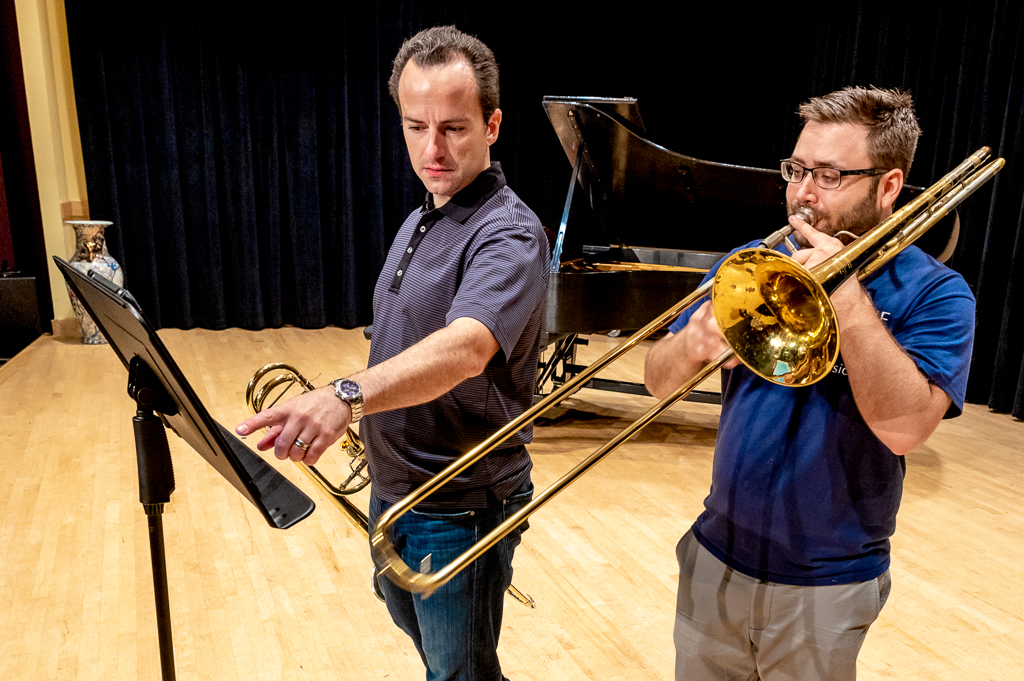 A private trombone instructor teaches a lesson.