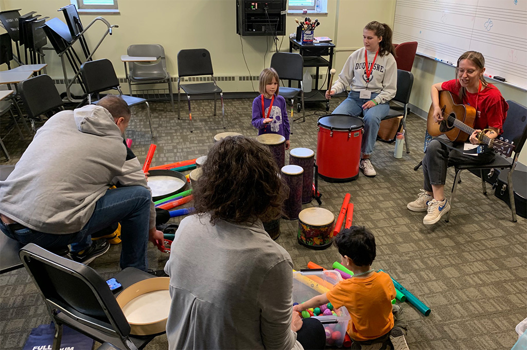 Several people in a drum circle.