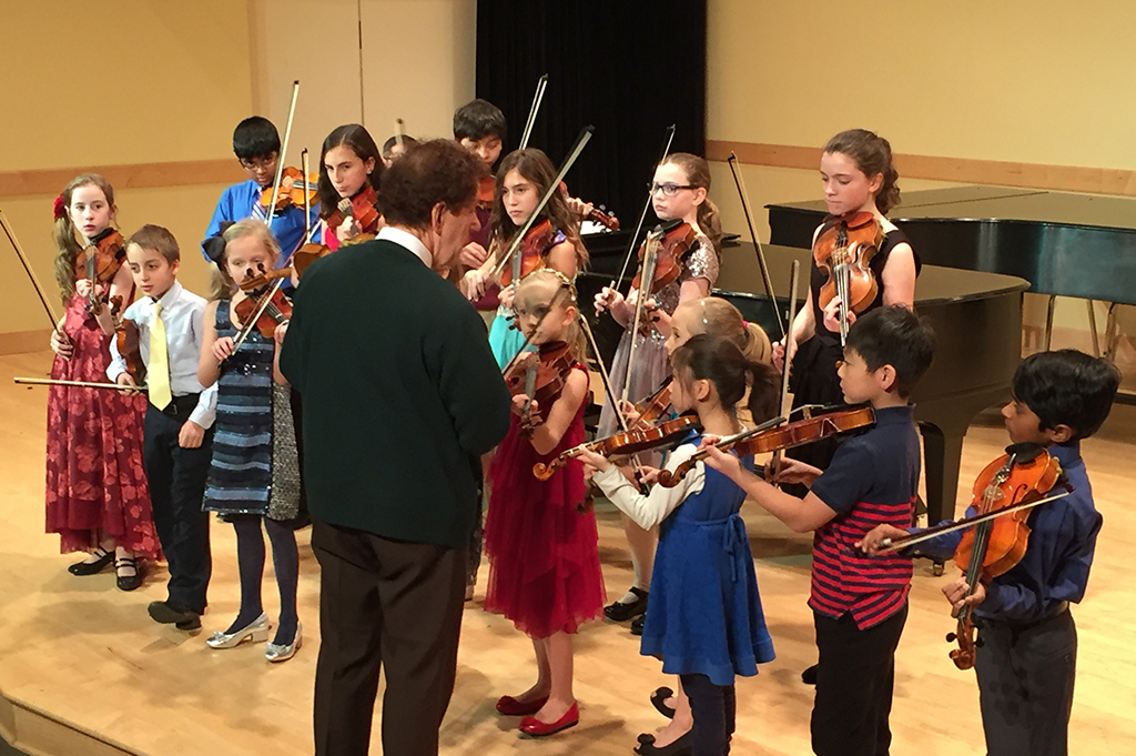 group of suzuki violin students