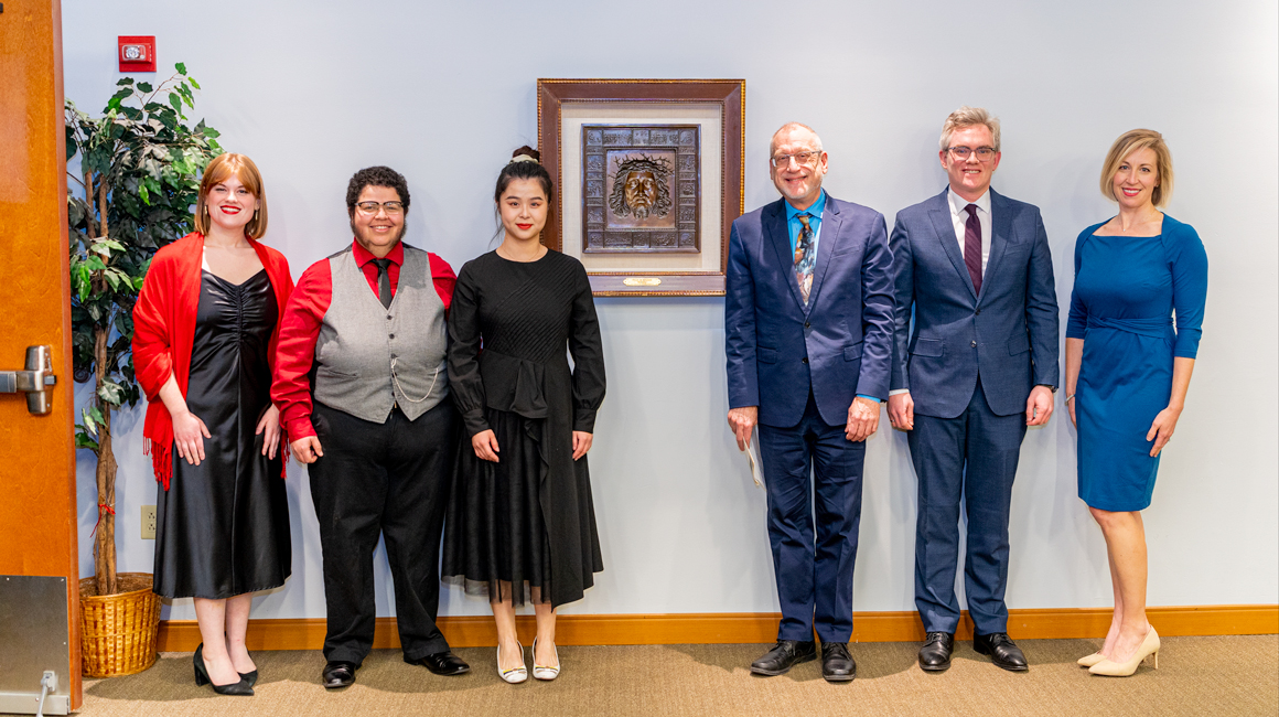 Competition winners pose with judge and faculty members.