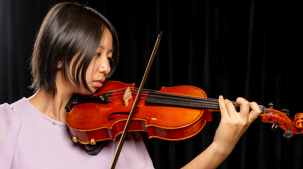 A violinist performs.