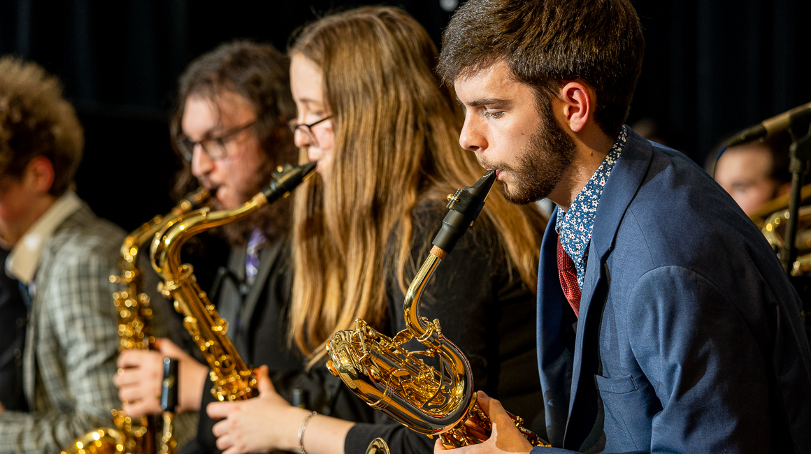Saxophonists performing.