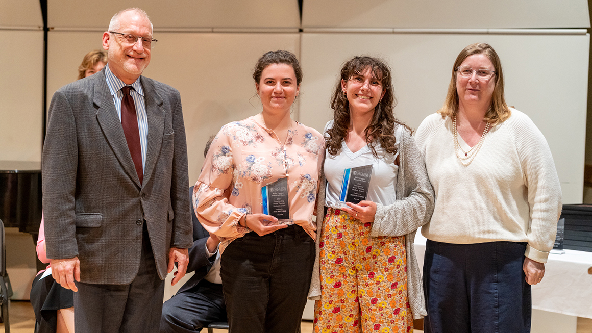 Students pose with their awards, alongside Dean and Department Chair for a photo.