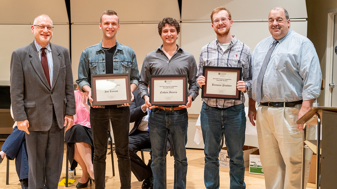 Students pose with their awards, alongside Dean and Department Chair for a photo.