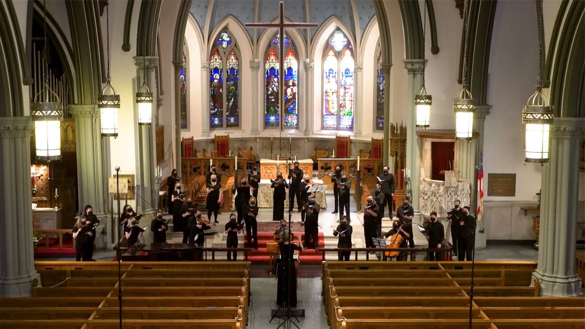 A choir performs in a church.