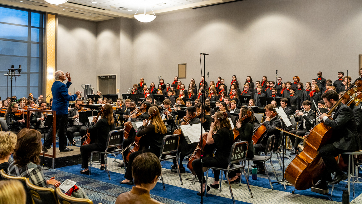 A large ensemble performs.