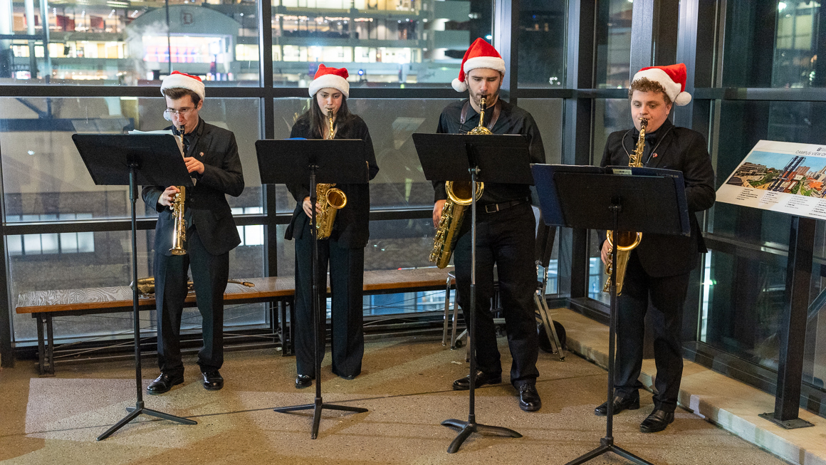 A saxophone quartet performs.