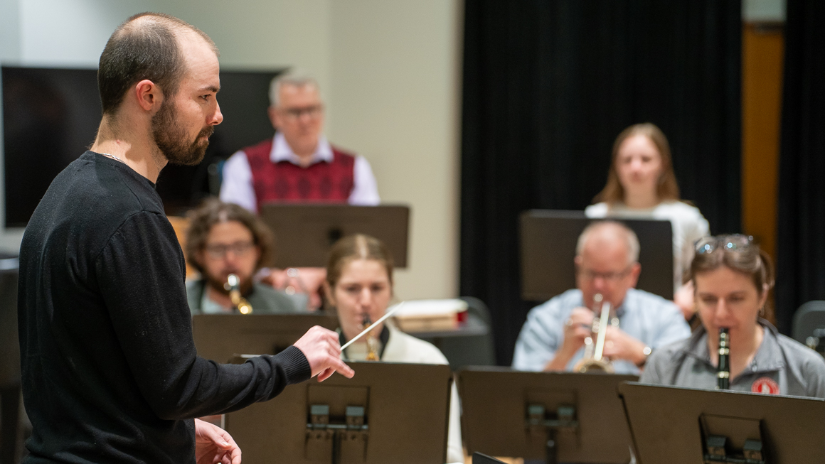 A student conducts an ensemble.