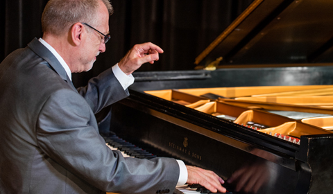 David Allen Wehr plays a piano.