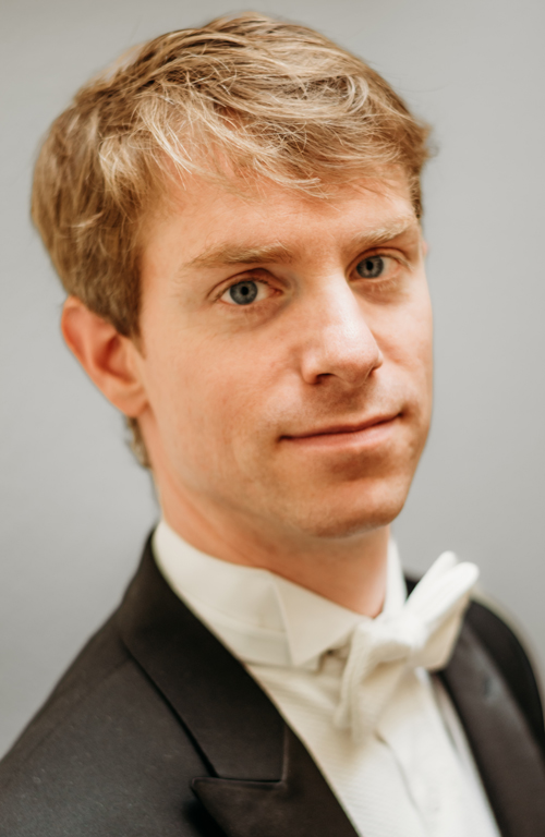 Headshot of a man wearing a tuxedo.