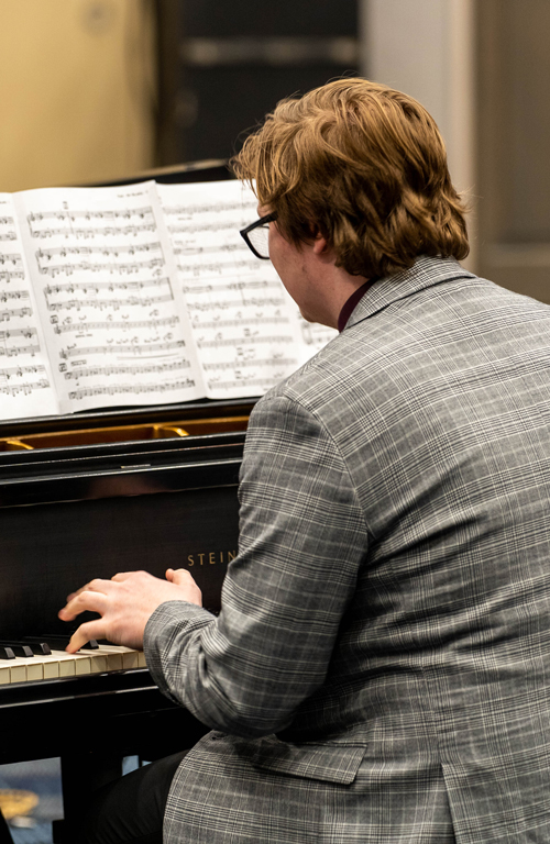 Alex Luketich playing the piano.