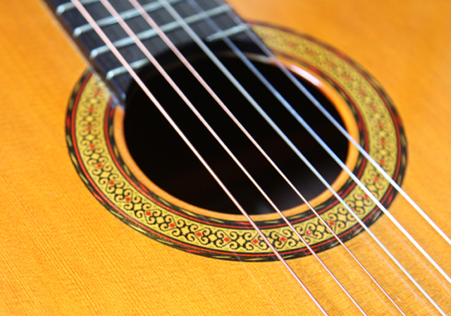 Closeup image of a classical guitar.
