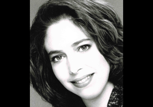 Black and white headshot of Tina Faigen.