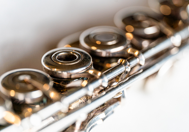 Closeup image of a flute on a white background.