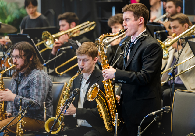 A saxophone soloist performs.