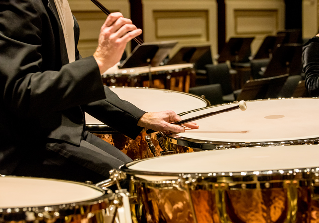 A timpanist performs.