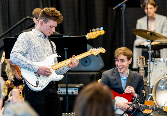 Guitarist performing.