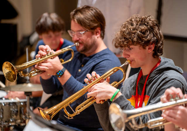 Trumpet players performing.