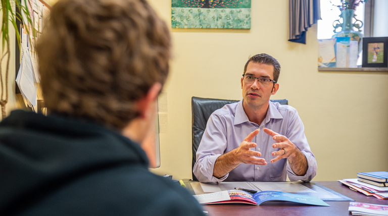 Tom Carsecka talks with a prospective student.