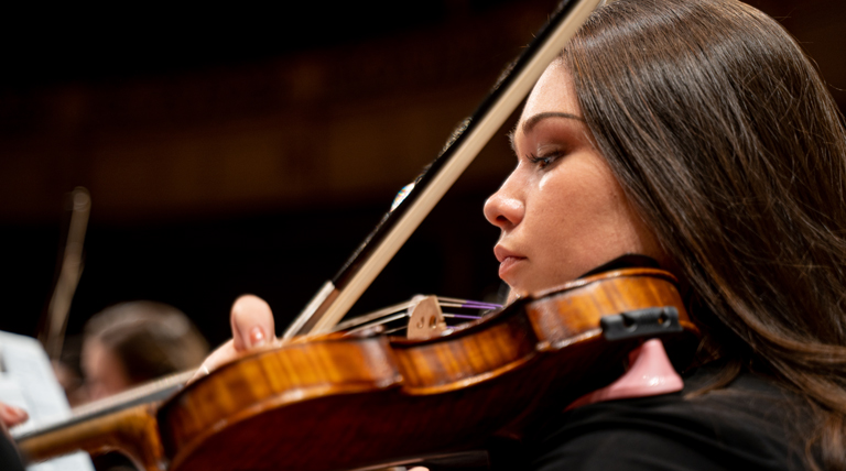 Violinist performs.