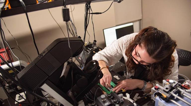 a girl looking at equipment
