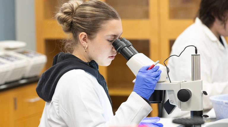 girl holding molecules 