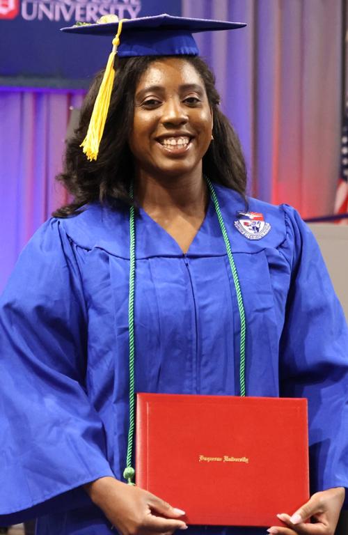 Alysia McCray wearing a graduation cap and gown