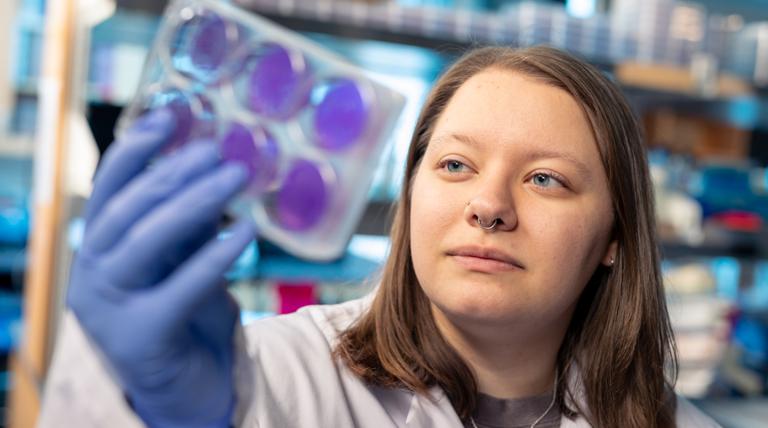 girl holding molecules 