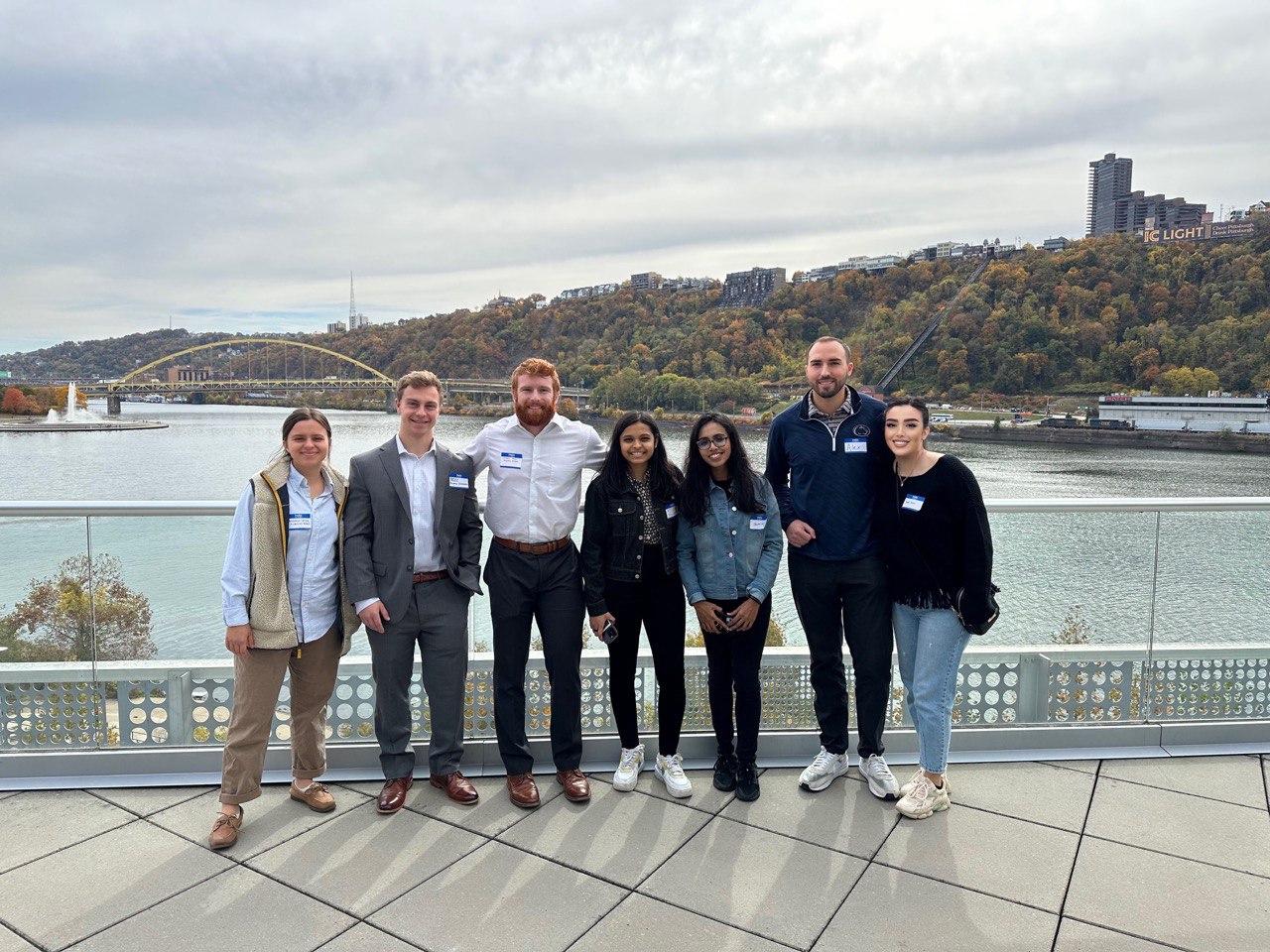 students in front of a river