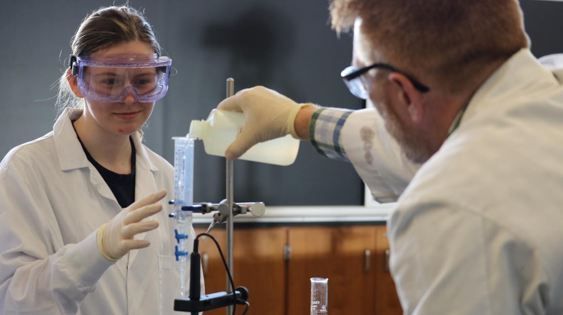 a picture of a faculty doing research with a student
