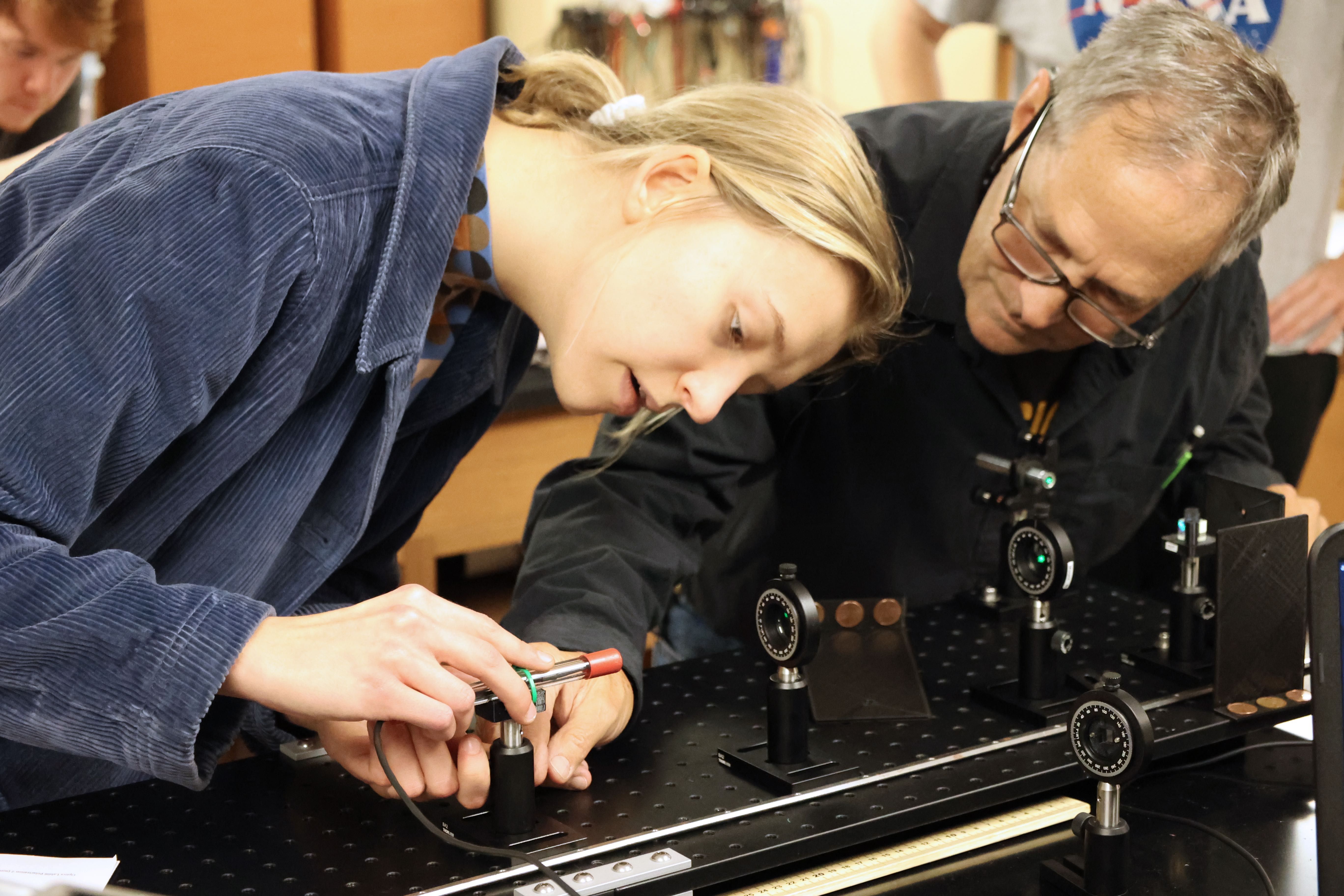 two people working on a research instrument
