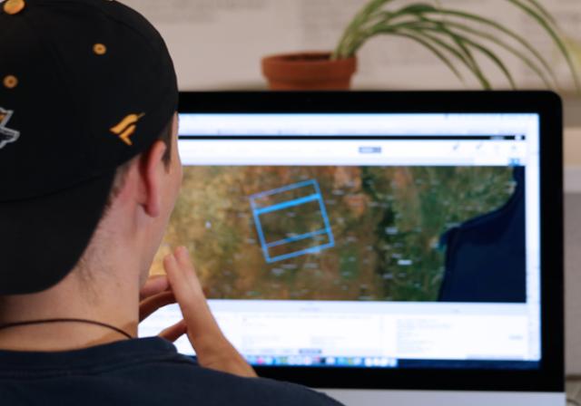 male looking at a computer