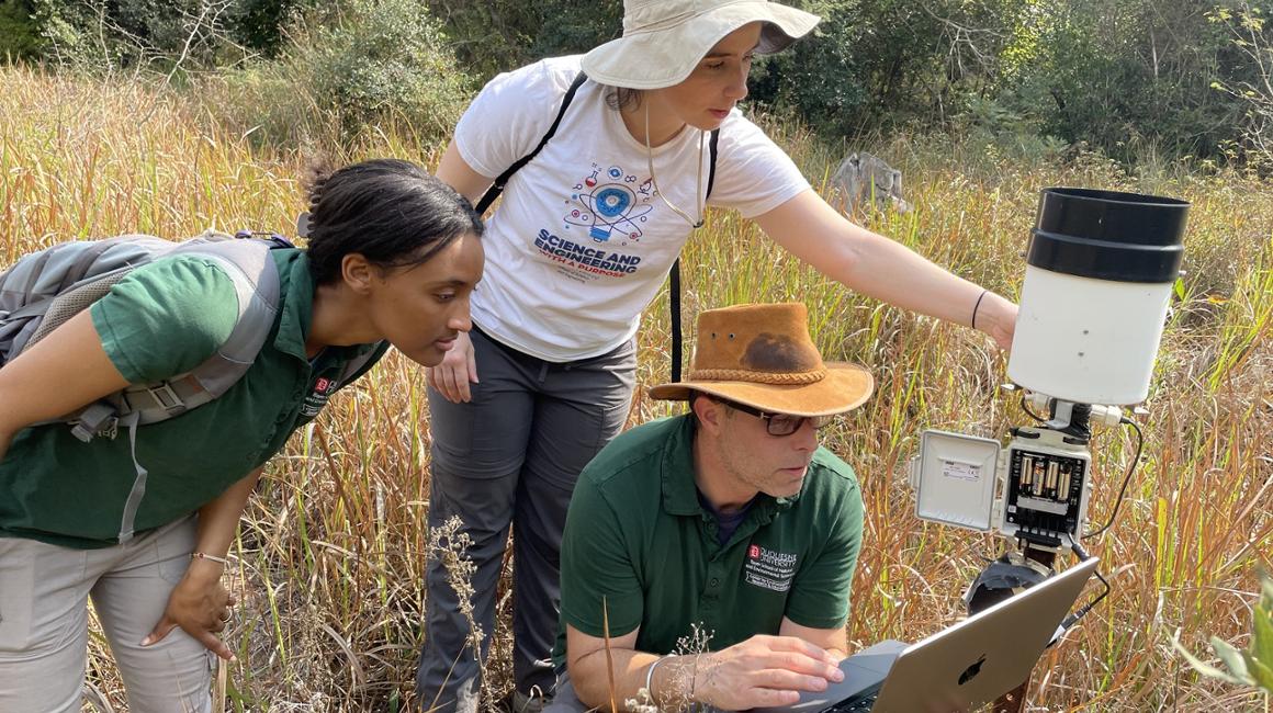 people in the jungle doing environmental research