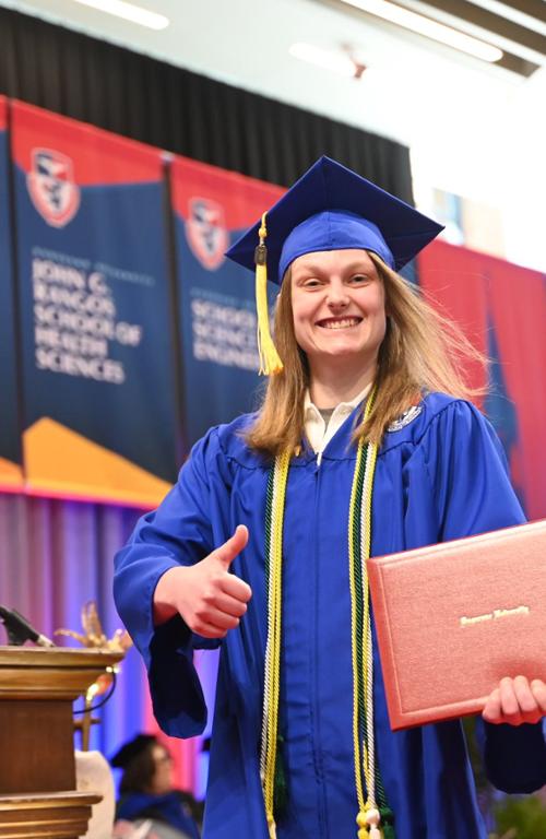 a student in her cap and gown