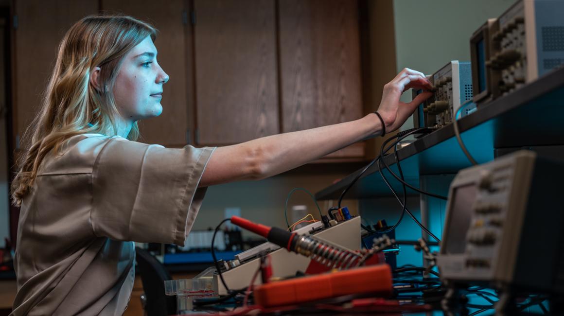 a picture of a student working in a labratory