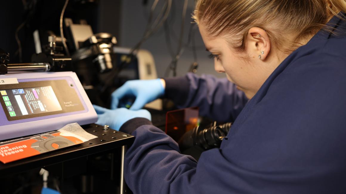 a picture of a student working in a labratory