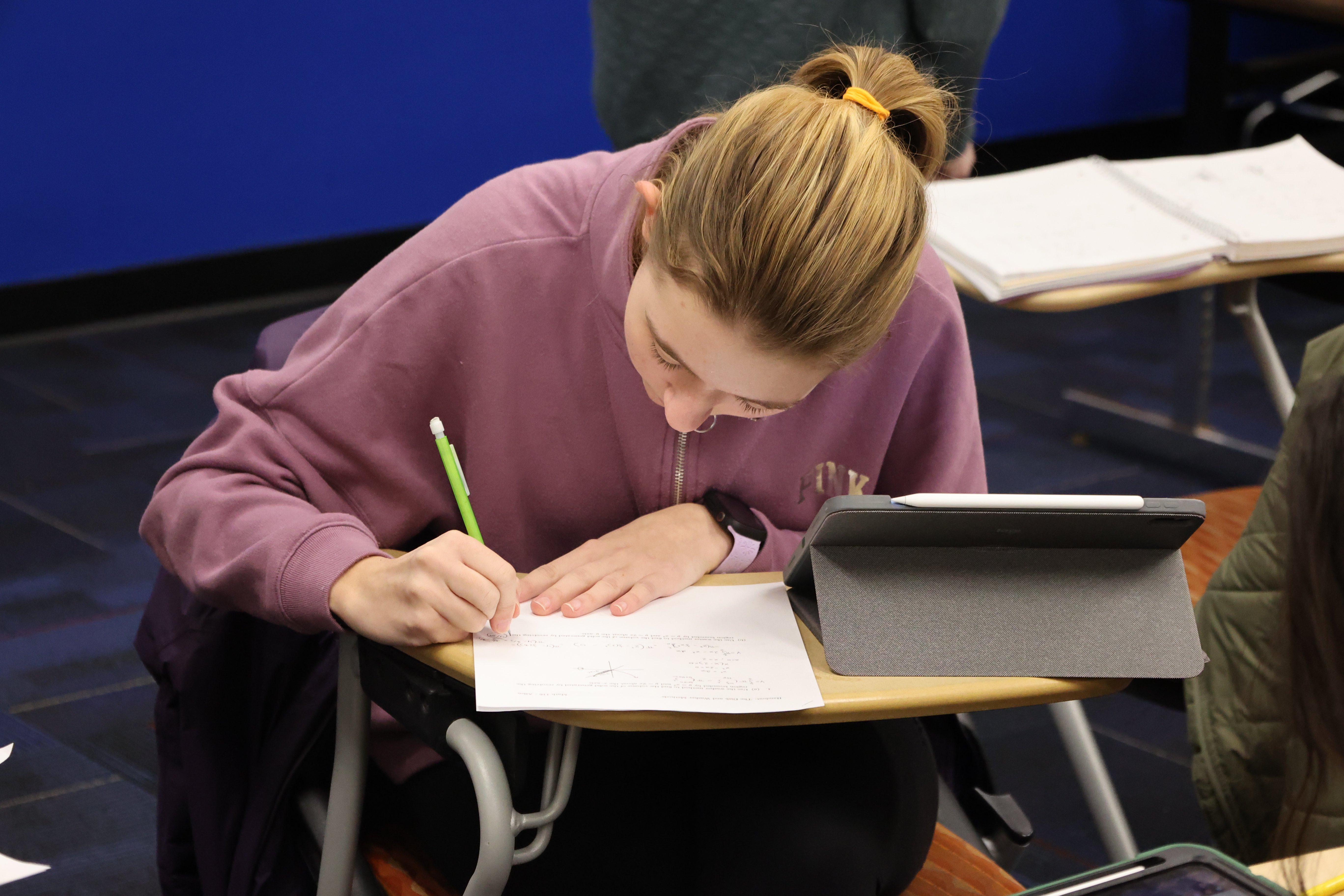 girl writing on a board