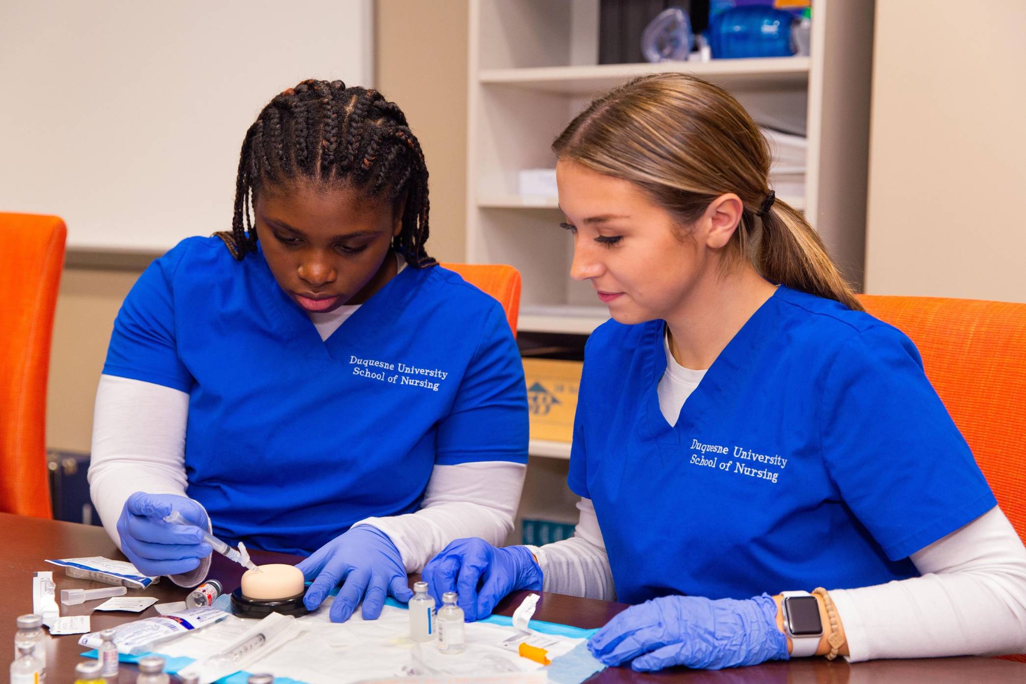 two female nursing students in the lab