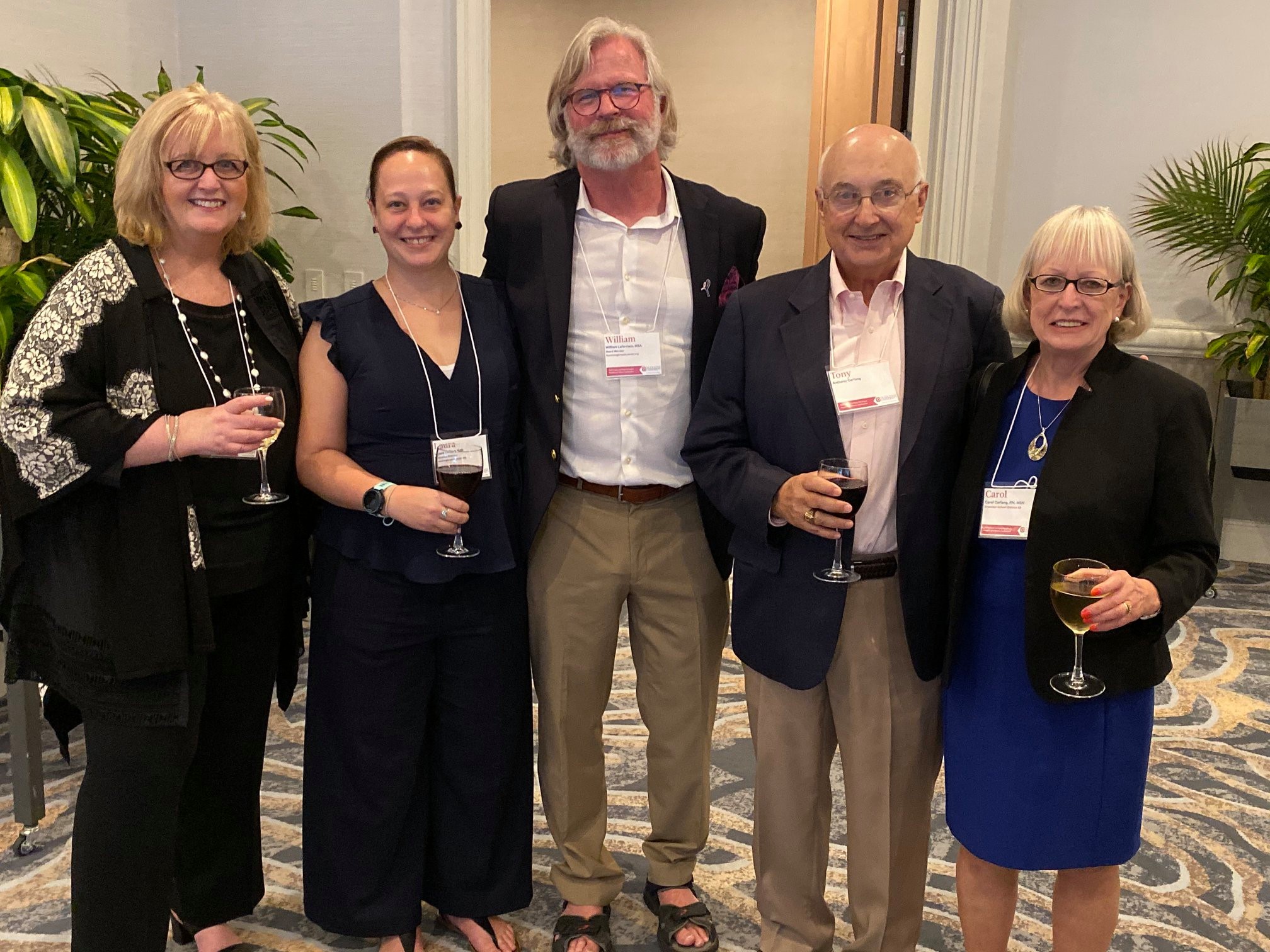 Dean Mary Ellen Glasgow with the Carfang family at the 2020 conference.