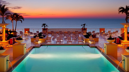 Hotel pool at sunset.