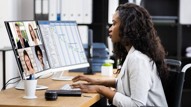 woman in a lab coat on a computer