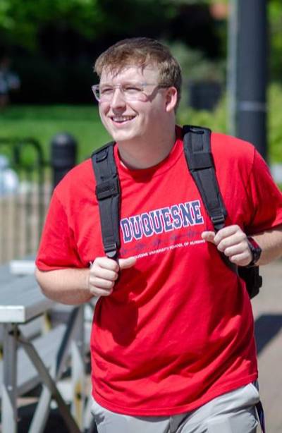 nursing student walking outside