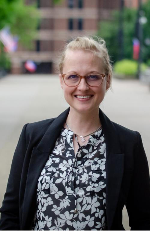 PhD nursing student standing outside