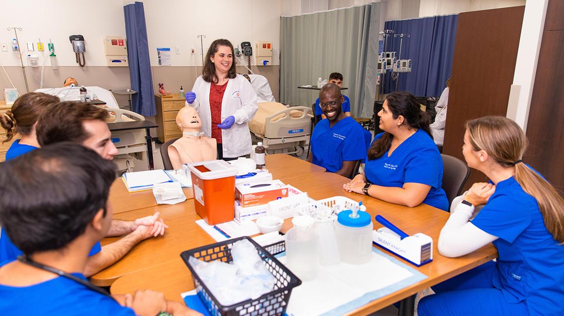 BSN students with faculty in the Skills Lab