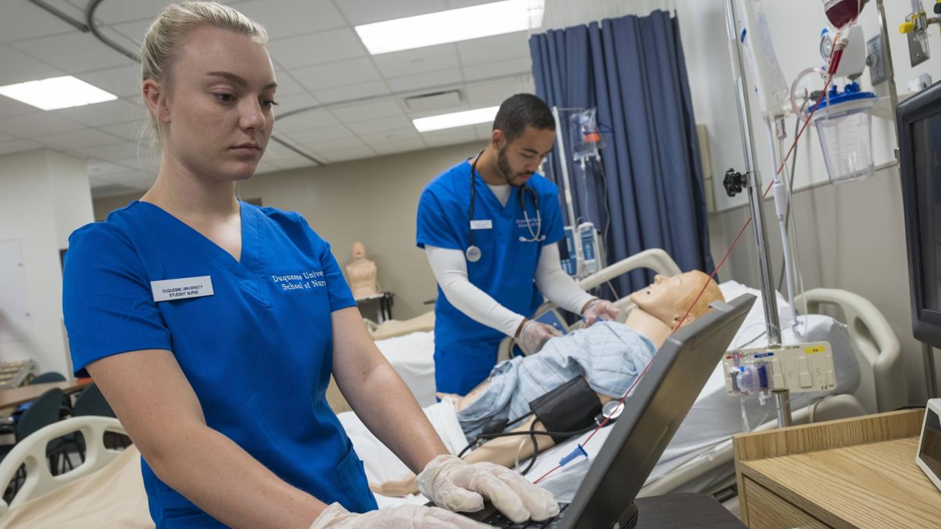 BSN students with faculty in the Skills Lab