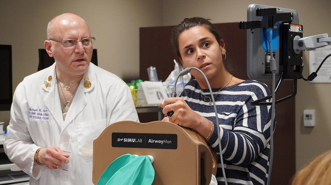 Student and professor in lab